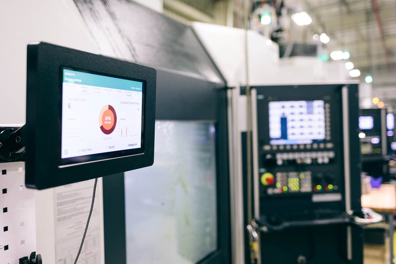 Operator Interfacing with Tablet at Machine