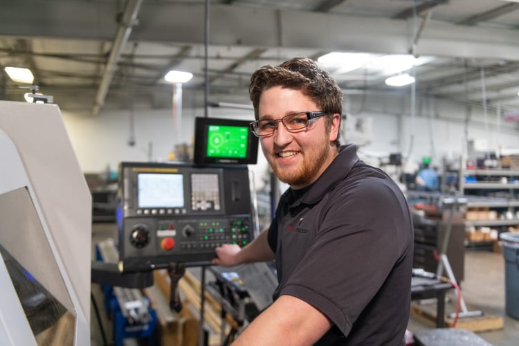 Operator Smiling at Machine.