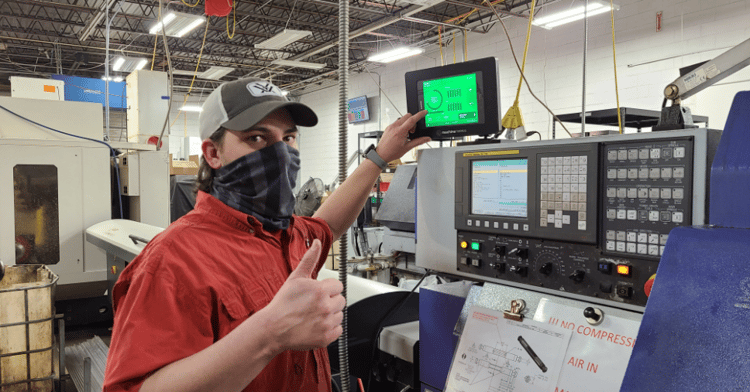 Operator Thumbs Up at CNC Machine.